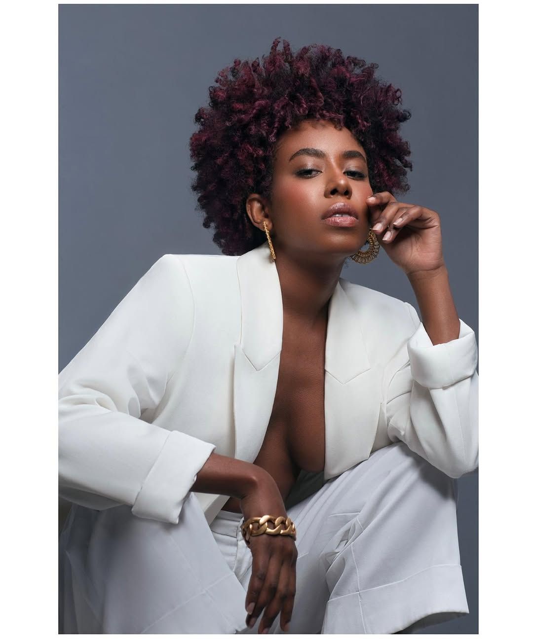 Hair stylist cutting long hair