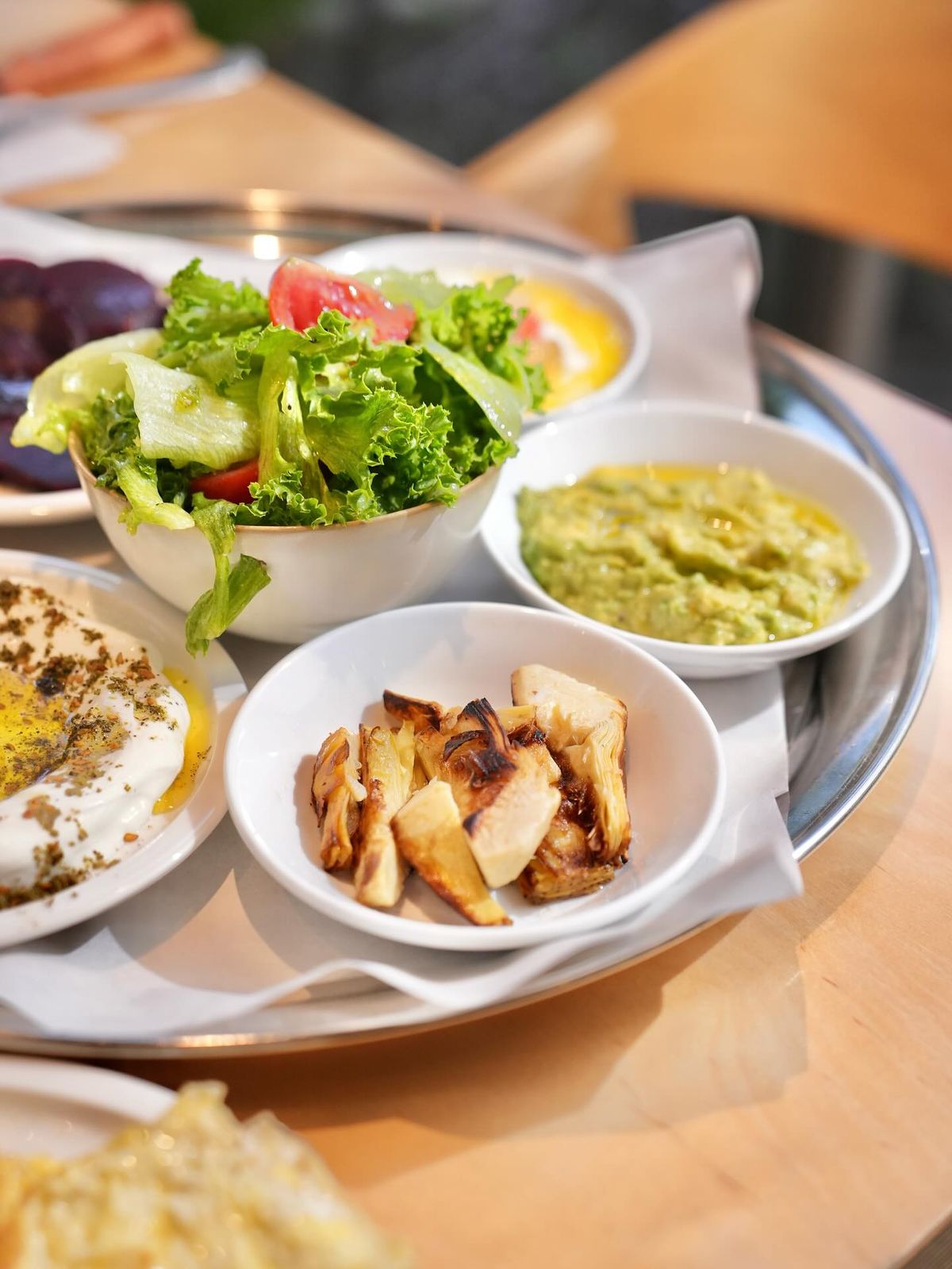 Modern bright cafe interior with fresh pastries and coffee