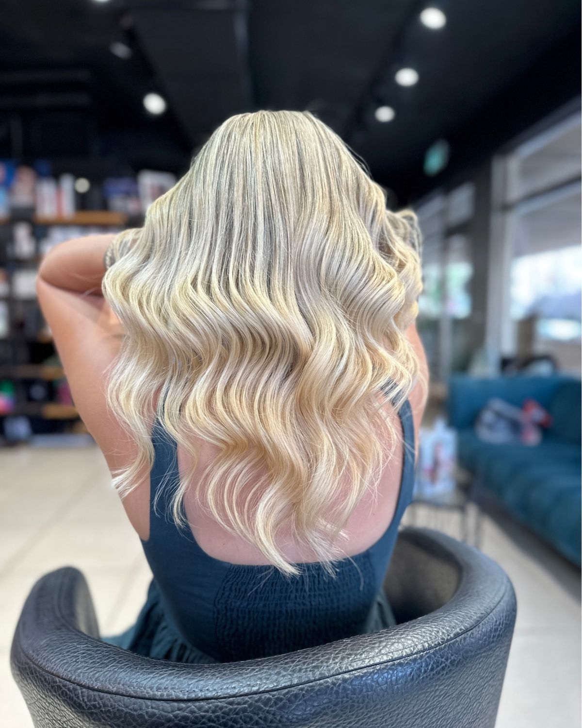 Interior of a luxury modern hair salon with warm lighting
